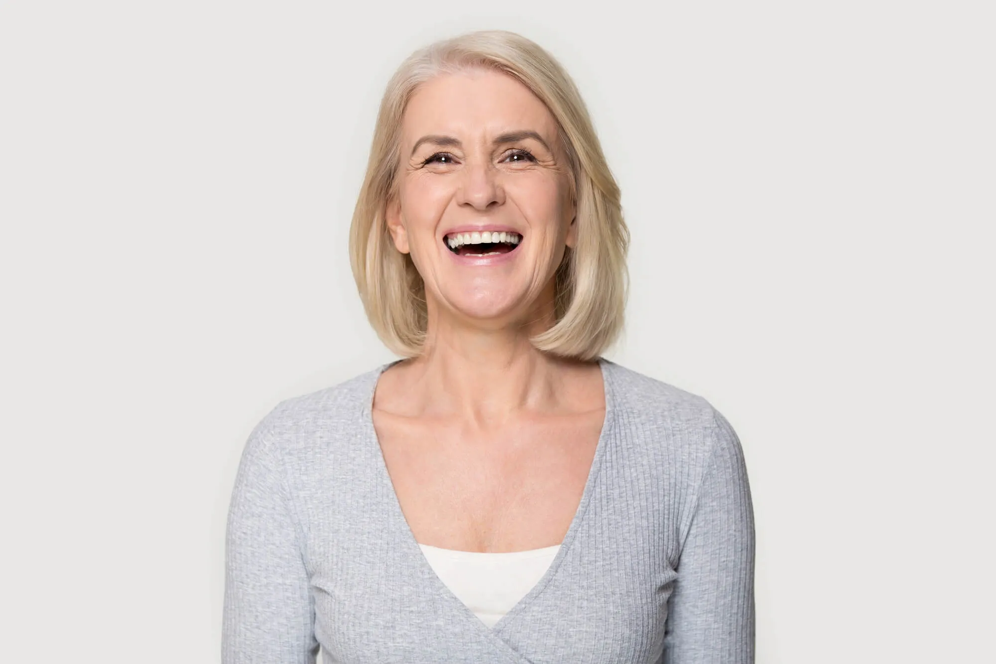beautiful senior wearing a Tooth implant burtonsville