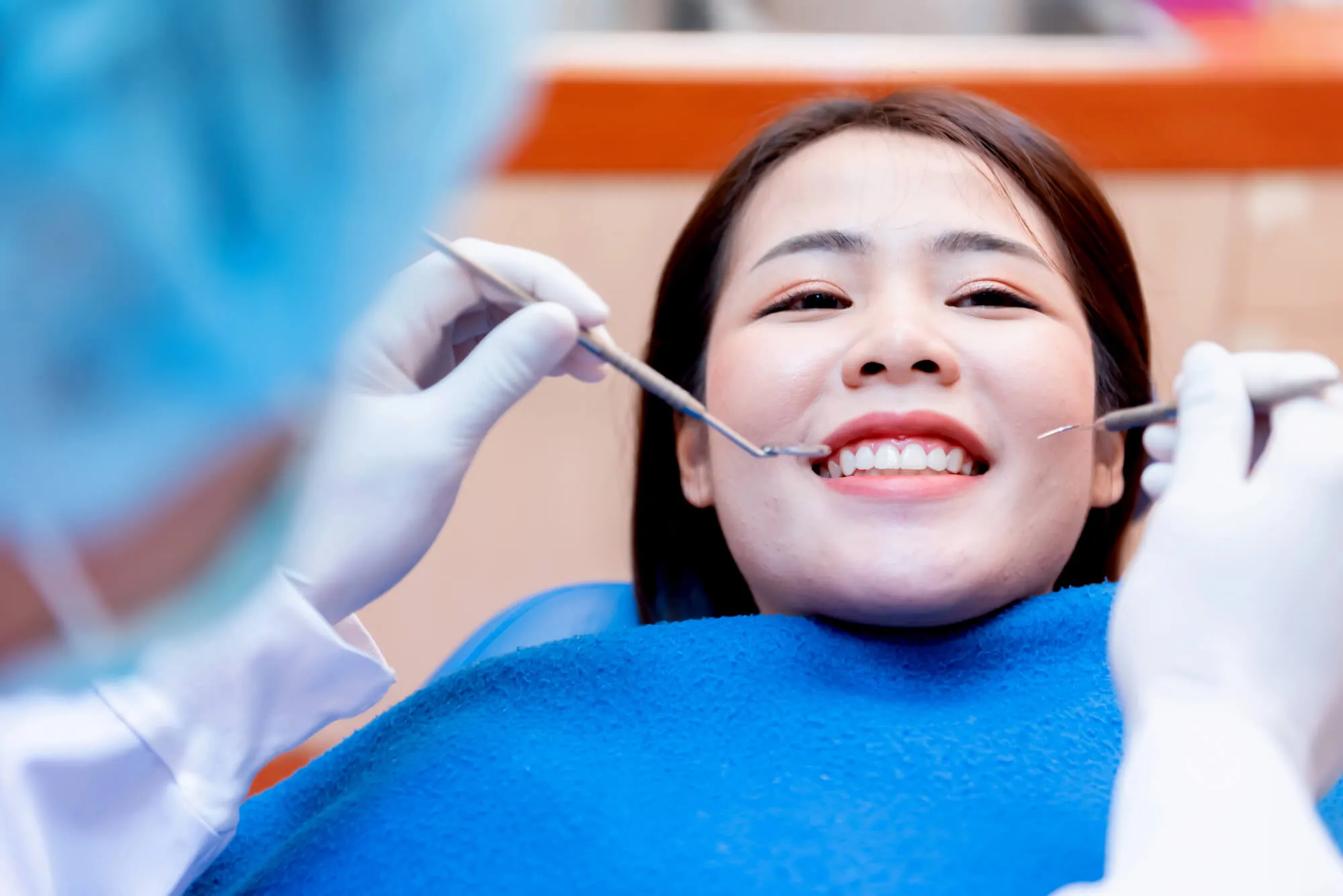 patient in the dental office asking about Cost of dental implants maryland