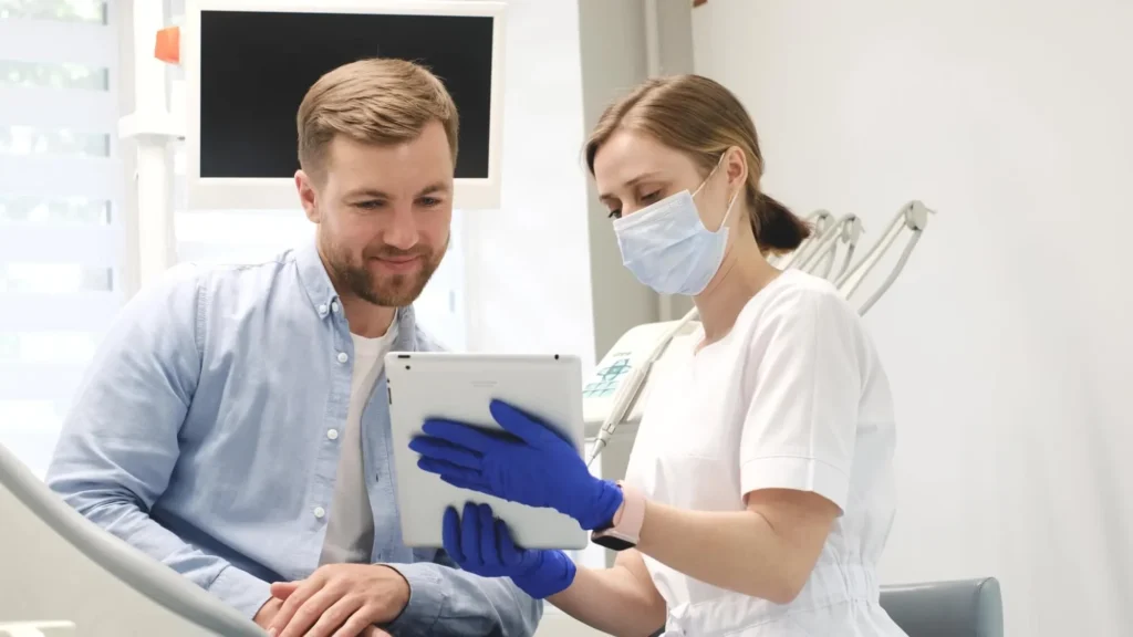holistic dentist explaining a Tooth implant burtonsville